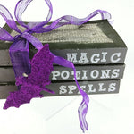 Load image into Gallery viewer, Halloween Decorative Tied Book Stack Magic Potions Spells Purple Bat and Ribbon
