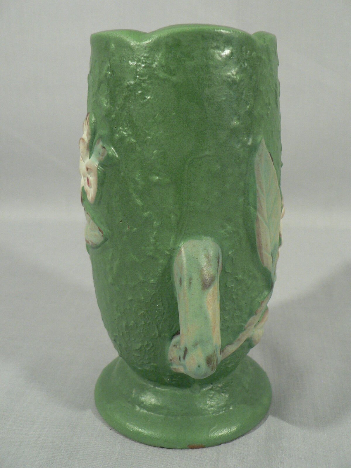 Decorative vase planter floral design staggered handles bottom stamped Roseville