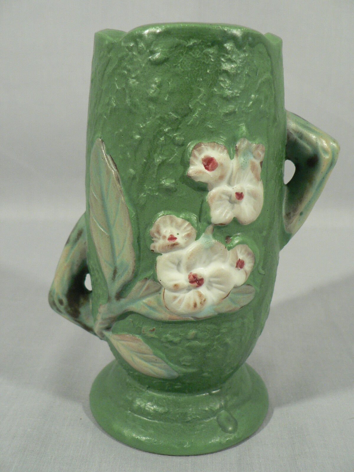 Decorative vase planter floral design staggered handles bottom stamped Roseville