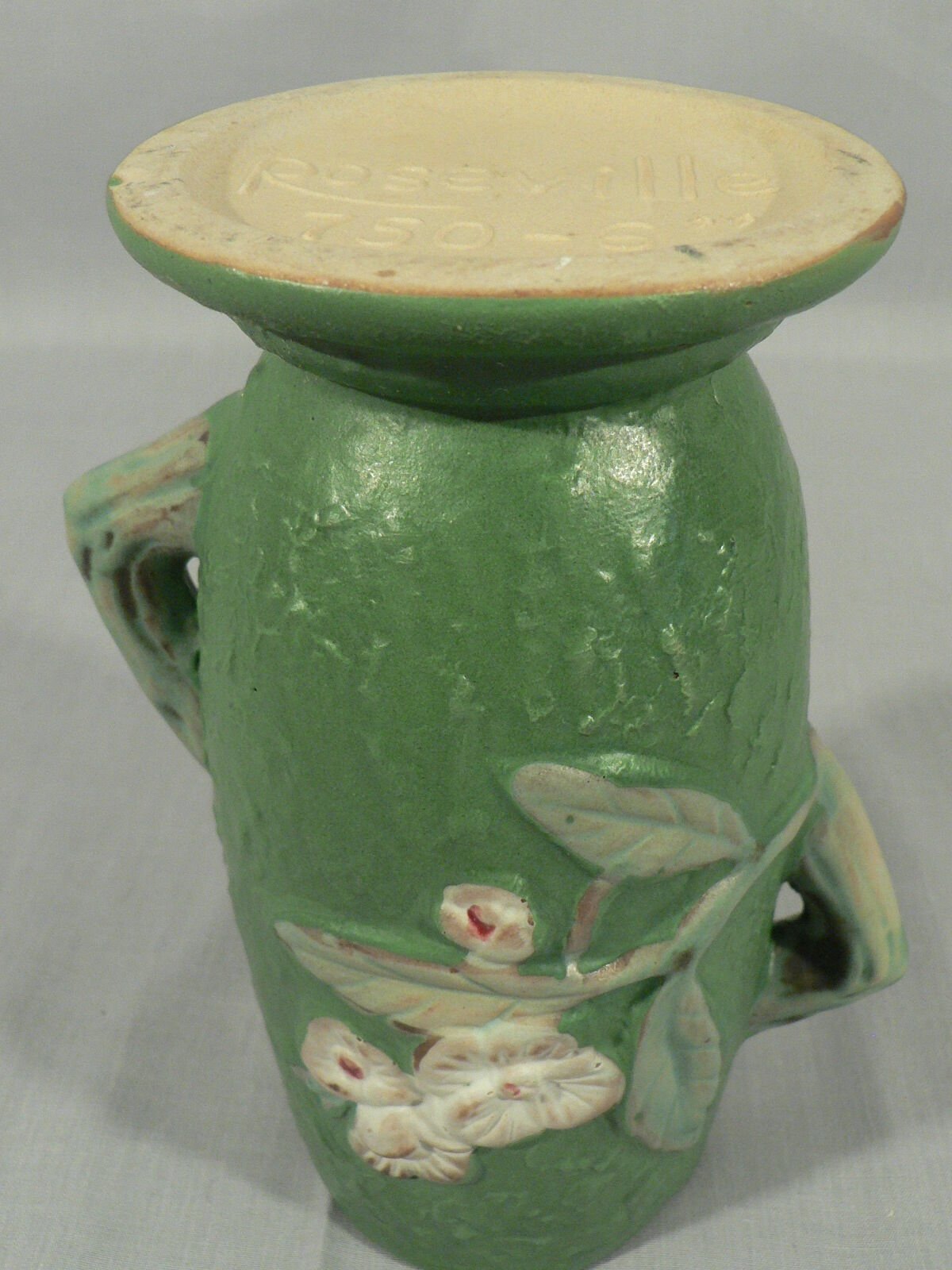 Decorative vase planter floral design staggered handles bottom stamped Roseville