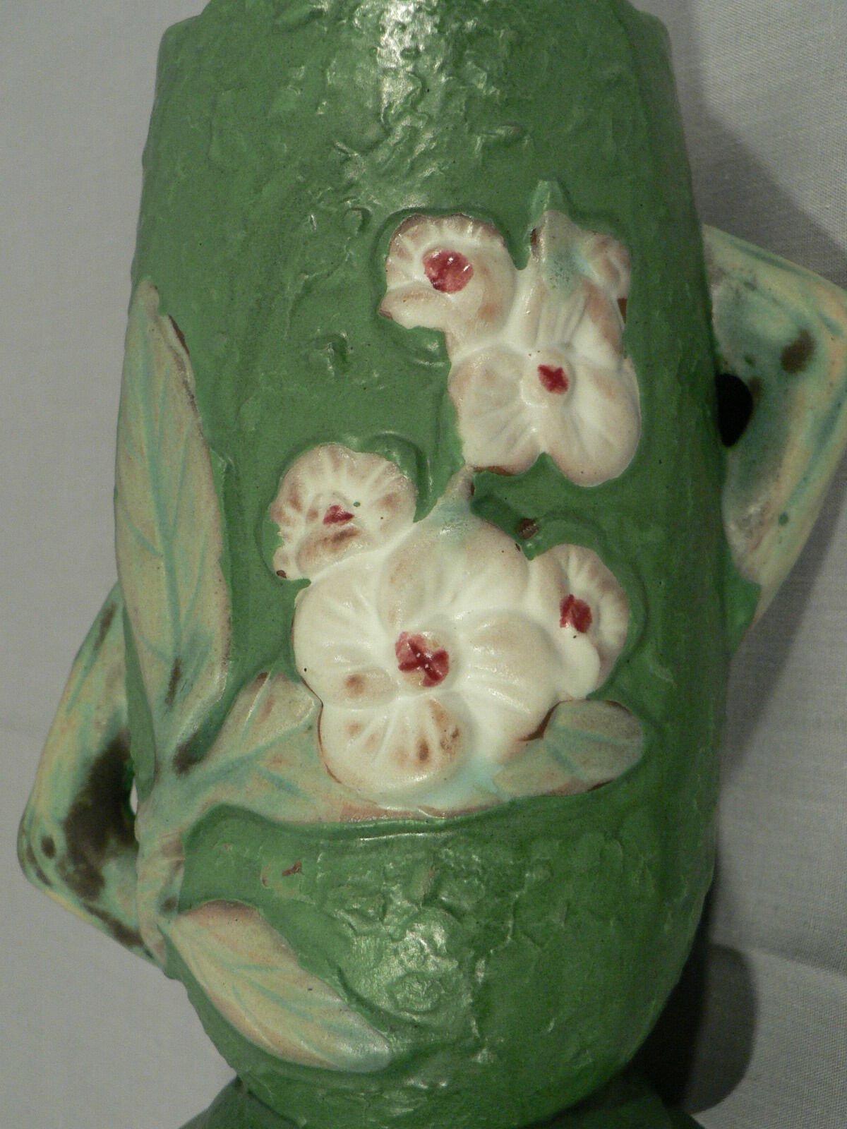 Decorative vase planter floral design staggered handles bottom stamped Roseville