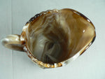 Load image into Gallery viewer, Slag Glass Pitcher Creamer Raised Windmill Images Caramel Swirl Vtg Imperial
